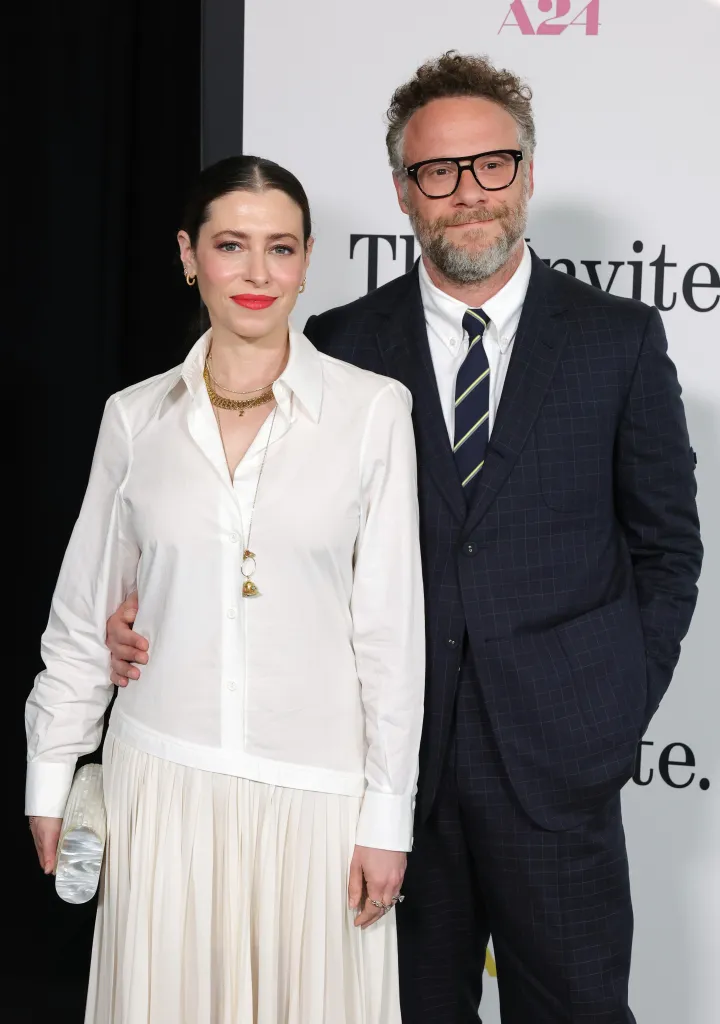 Lauren Miller Rogen and Seth Rogen posing at the Los Angeles premiere of "The Invite."