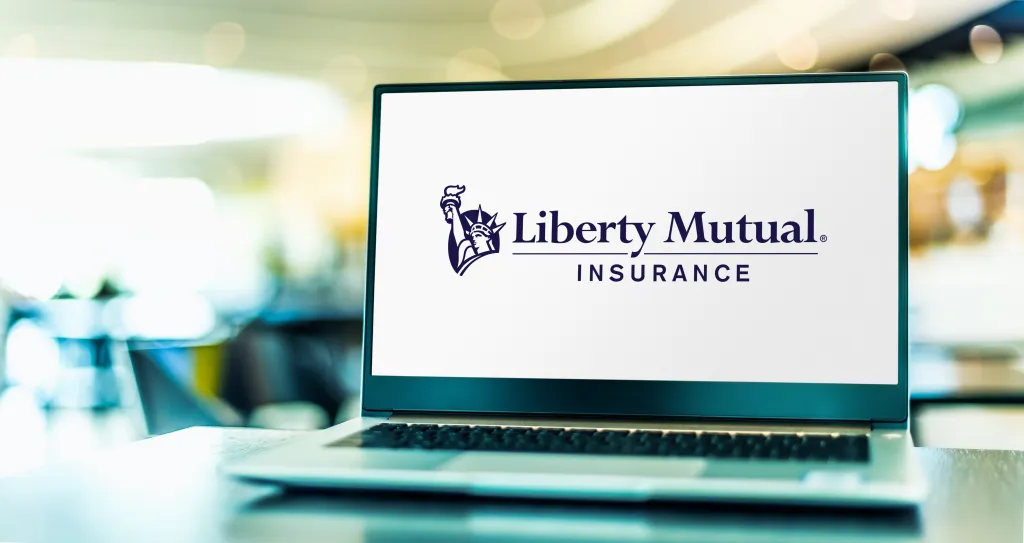 A laptop displaying the logo of Liberty Mutual Group.
