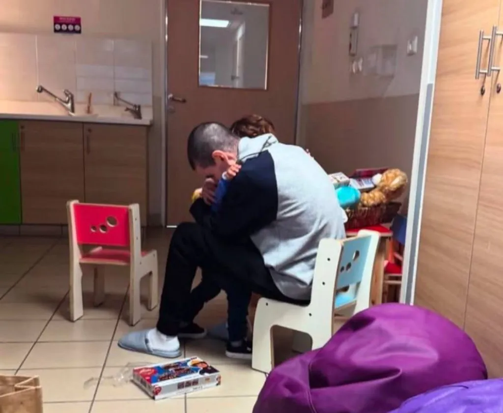 Or Levy embraces his 3-year-old son, Almog, after being released by Hamas.