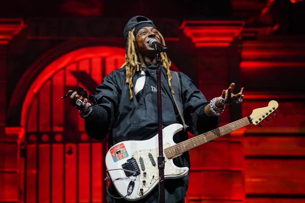 Lil Wayne performing onstage during Tha Carter VI Tour.
