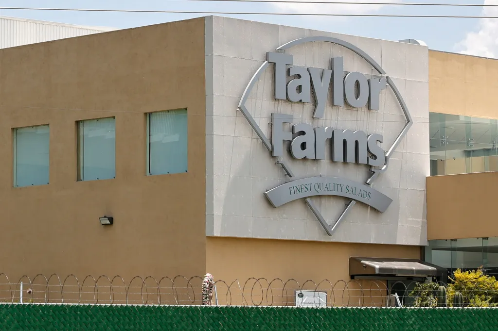 The Taylor Farms logo on the side of a building.