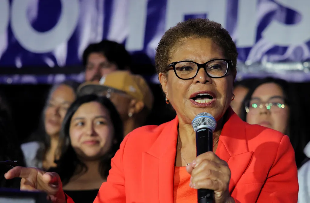 Los Angeles Mayor Karen Bass speaking into a microphone to supporters.