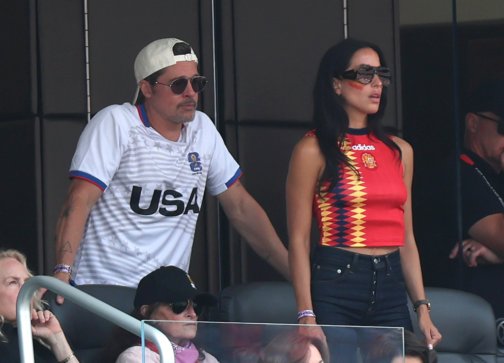 Brad Pitt and Ines de Ramon watching Spain defeat Belgium in the FIFA World Cup Quarter-Final.