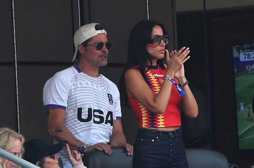 Brad Pitt and Ines de Ramon watching the Spain-Belgium FIFA World Cup quarter-final.