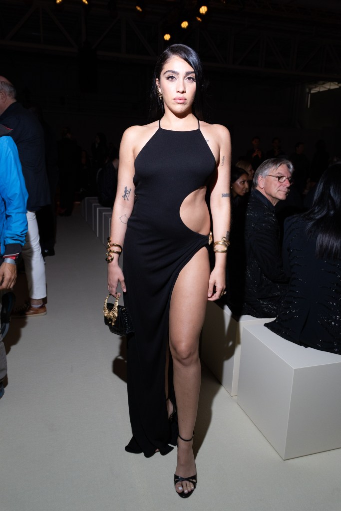 Lourdes Leon in a black halter-neck dress with a high slit, attending the Roberto Cavalli fashion show.