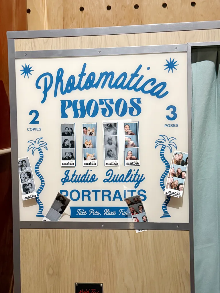 Photomatica photo booth with "Studio Quality Portraits" and sample photo strips.