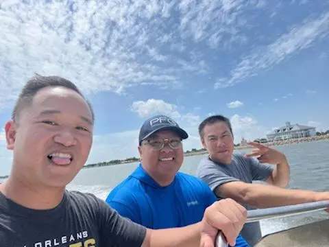 Lu Nguyen, Paul Le, and Sonny Nguyen Paul Le on a boat.