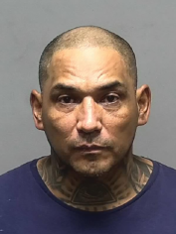 Mugshot of Luis Villachana, wanted in connection with a killing.