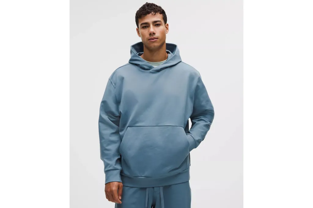 A man in a blue sweatshirt hoodie.