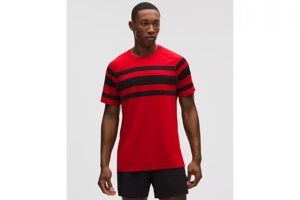 A man wearing a red and black shirt.