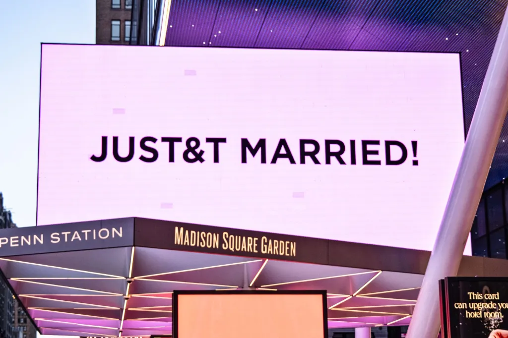 Madison Square Garden's exterior illuminated in pink with 