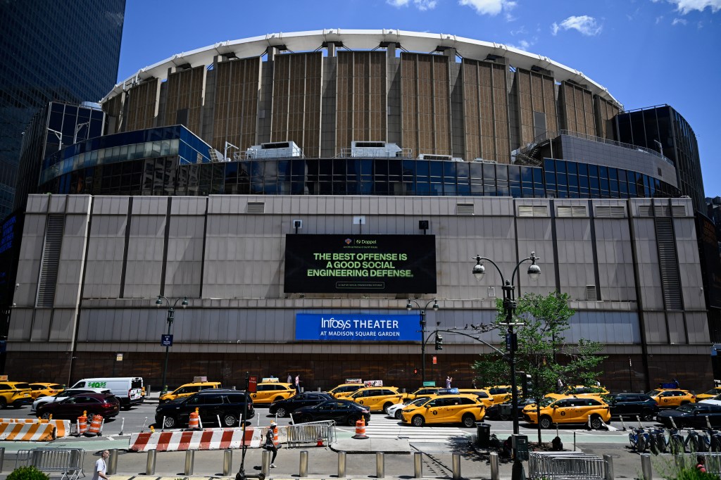 Madison Square Garden in New York City with a billboard advertising social engineering defense.