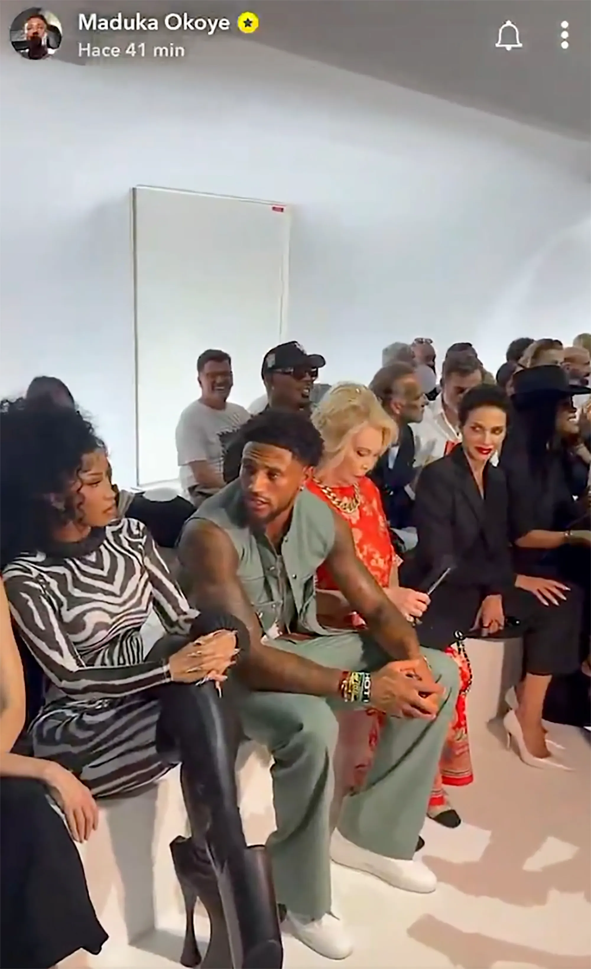 Maduka Okoye and Cardi B sitting together at an event.