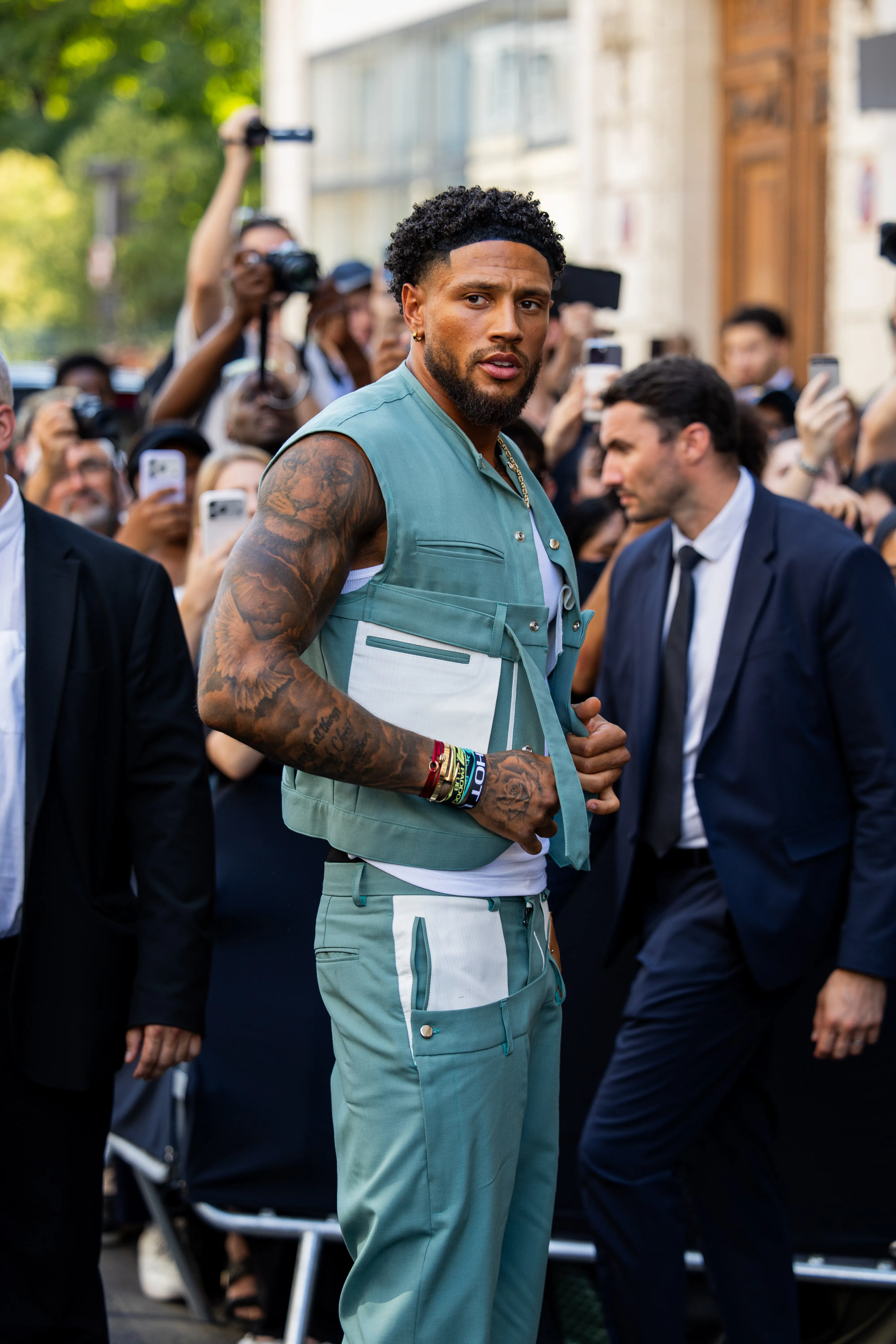 Maduka Okoye in a mint green vest and pants at Paris Fashion Week.