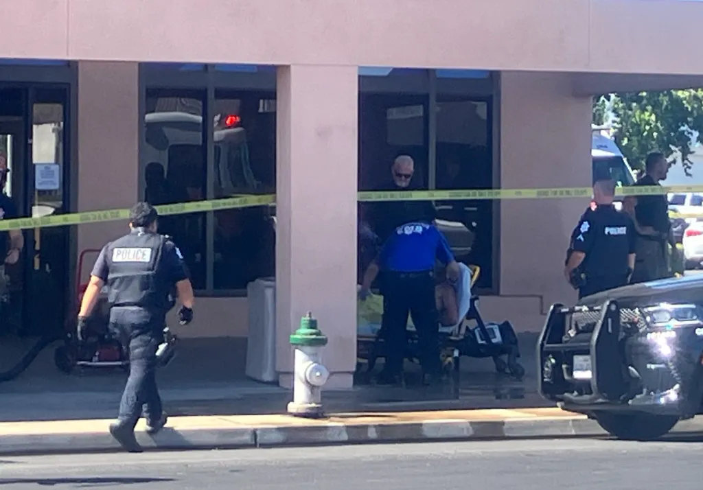Police and paramedics responding to a situation at a plasma center.