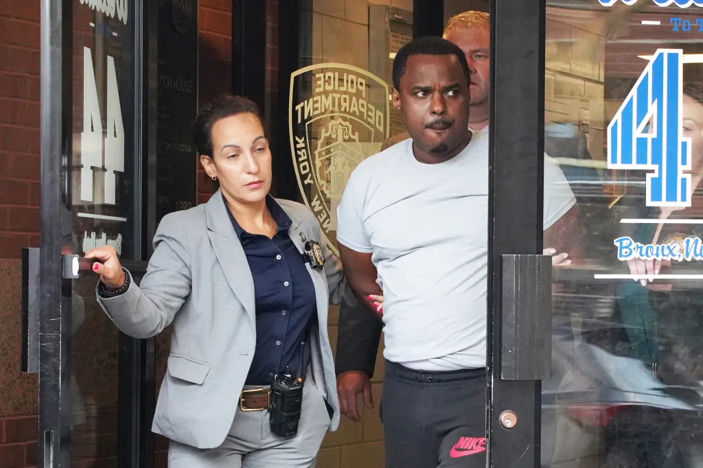 William Ferrer, suspect in a fatal shooting, escorted by detectives from the 44th Precinct.