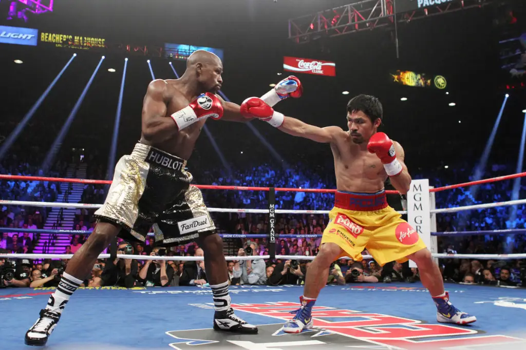 Manny Pacquiao and Floyd Mayweather Jr. trade punches during their welterweight unification boxing match.