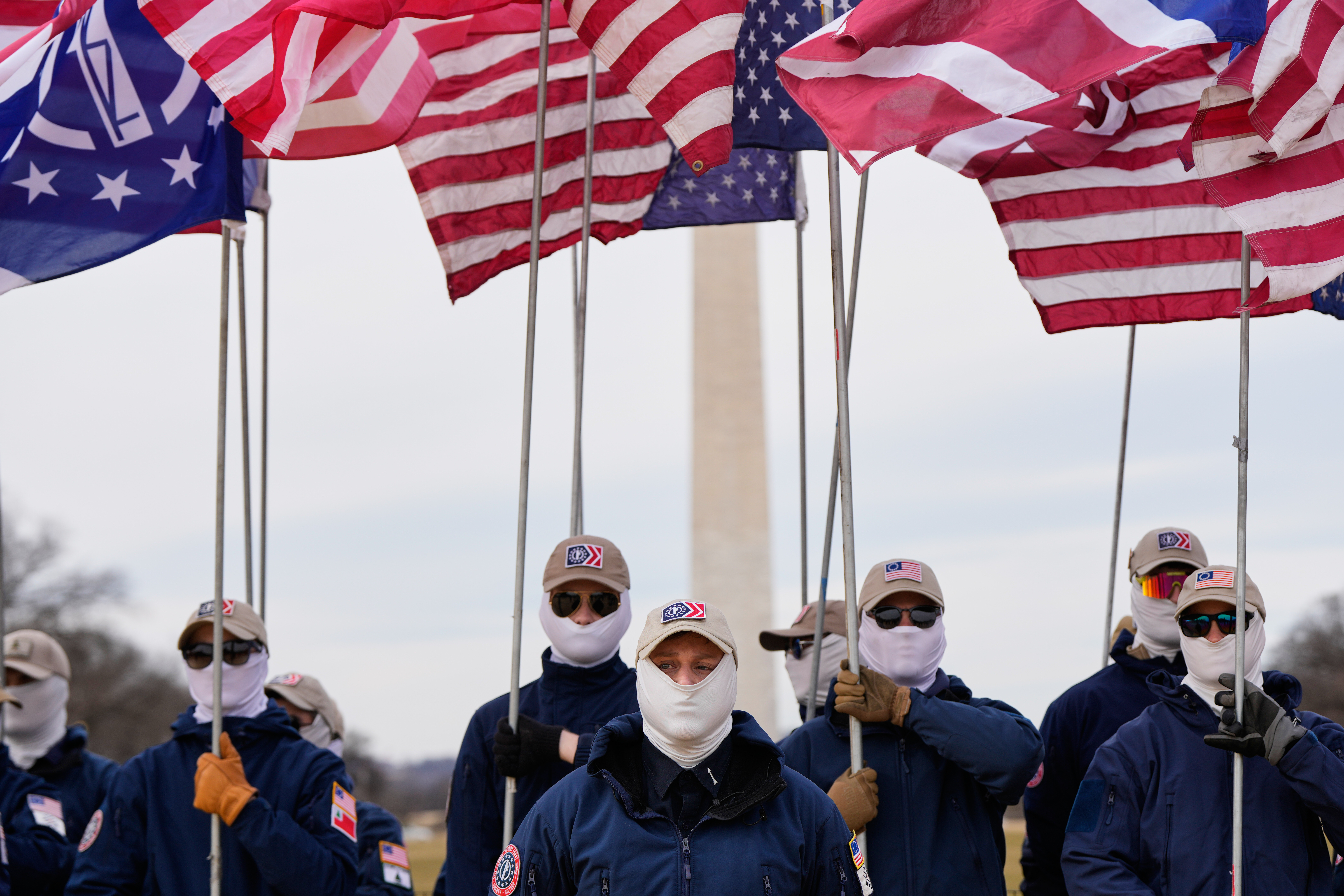 Demonstrators in white supremacist attire protest on Capitol Hill