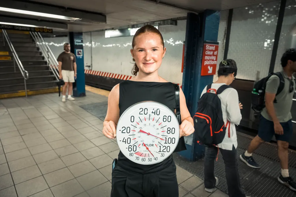 Mary Bace with a thermometer.