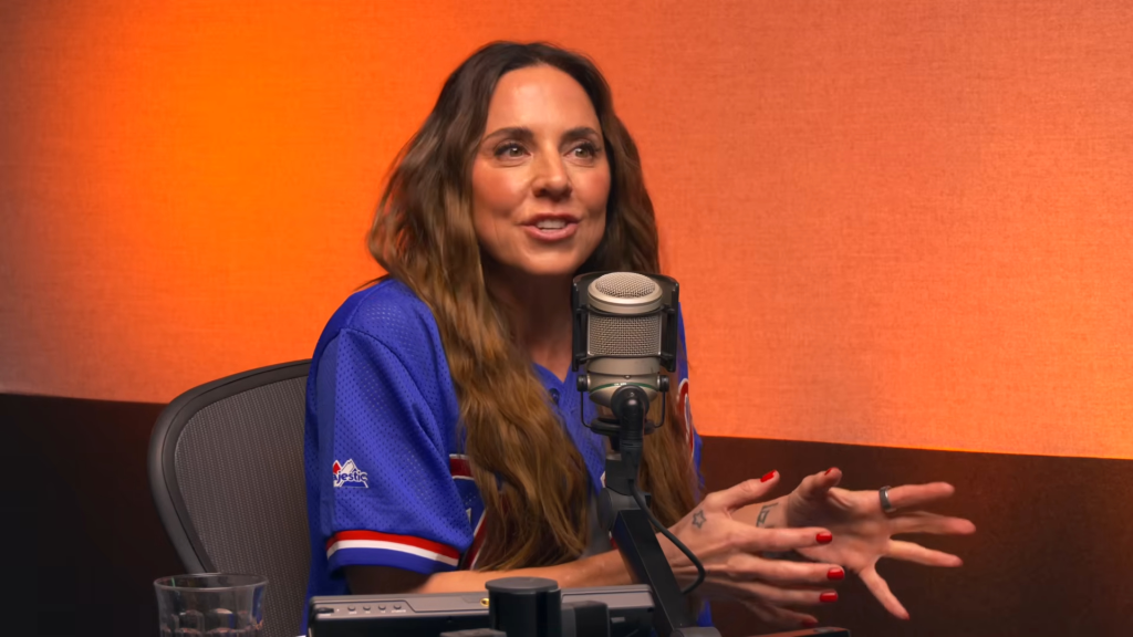 Melanie C speaking into a microphone.