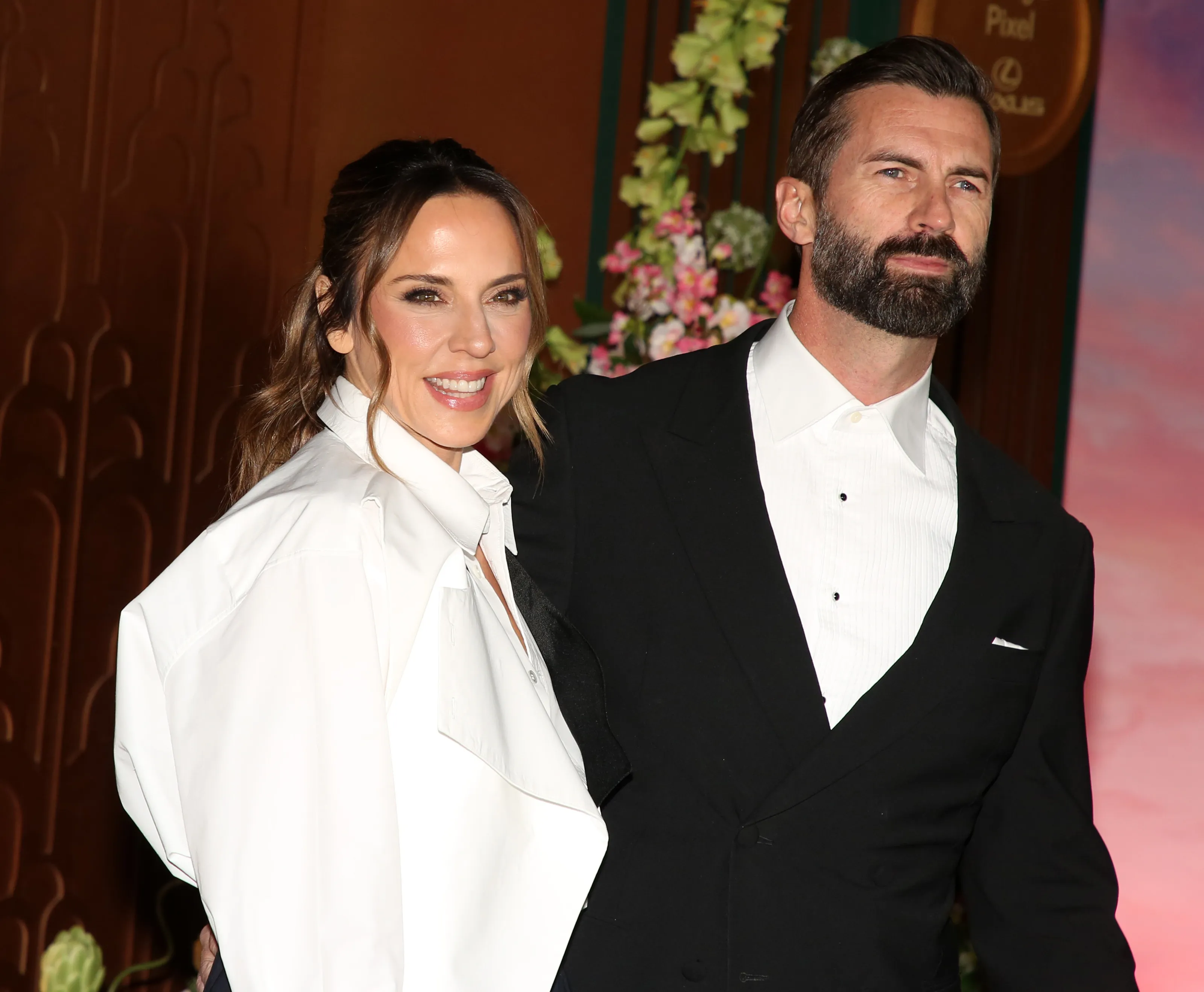 Melanie C and Chris Dingwall posing together.