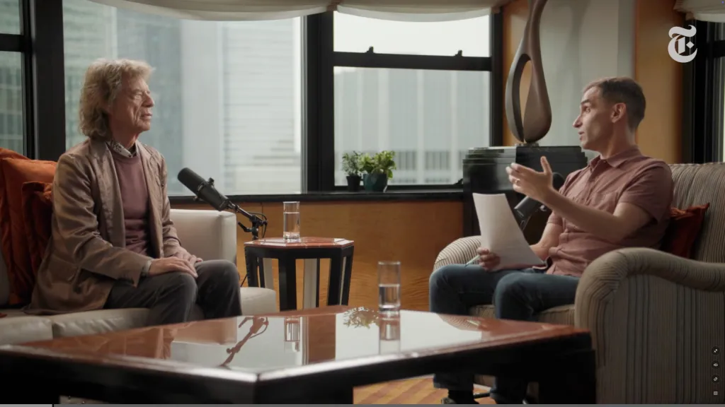 Mick Jagger and David Marchese seated and conversing during an interview.