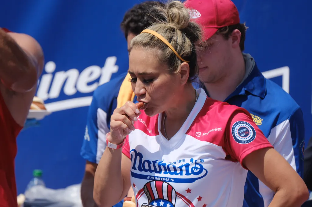 Miki Sudo eating a hot dog at Nathan's Hot Dog Eating Contest.