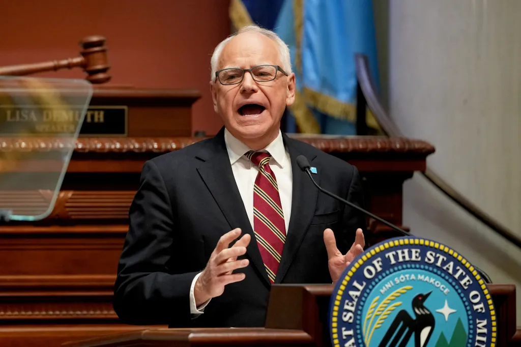 Minnesota Gov. Tim Walz delivering a speech at the State Capitol.