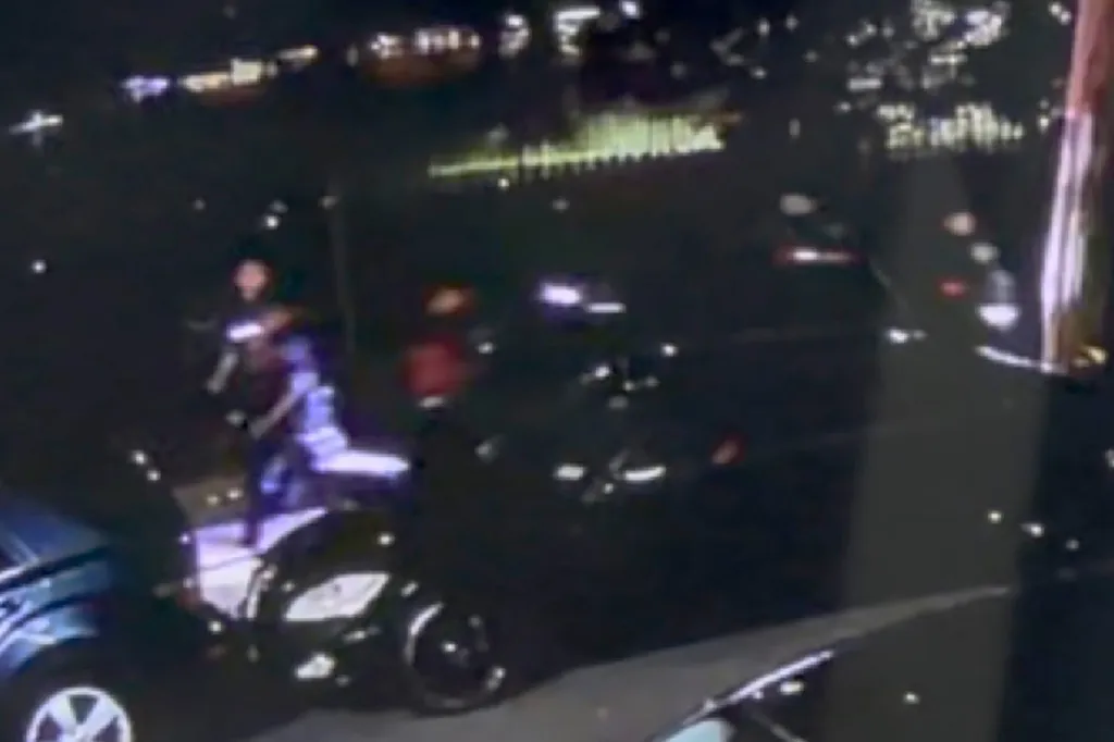 Police rushing to the scene where a gunman opened fire on an NYPD vehicle.
