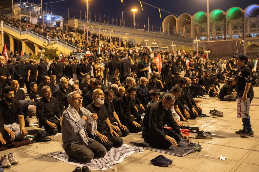 Mourners pray during a public farewell ceremony for the late Supreme Leader Ayatollah Ali Khamenei in Tehran.