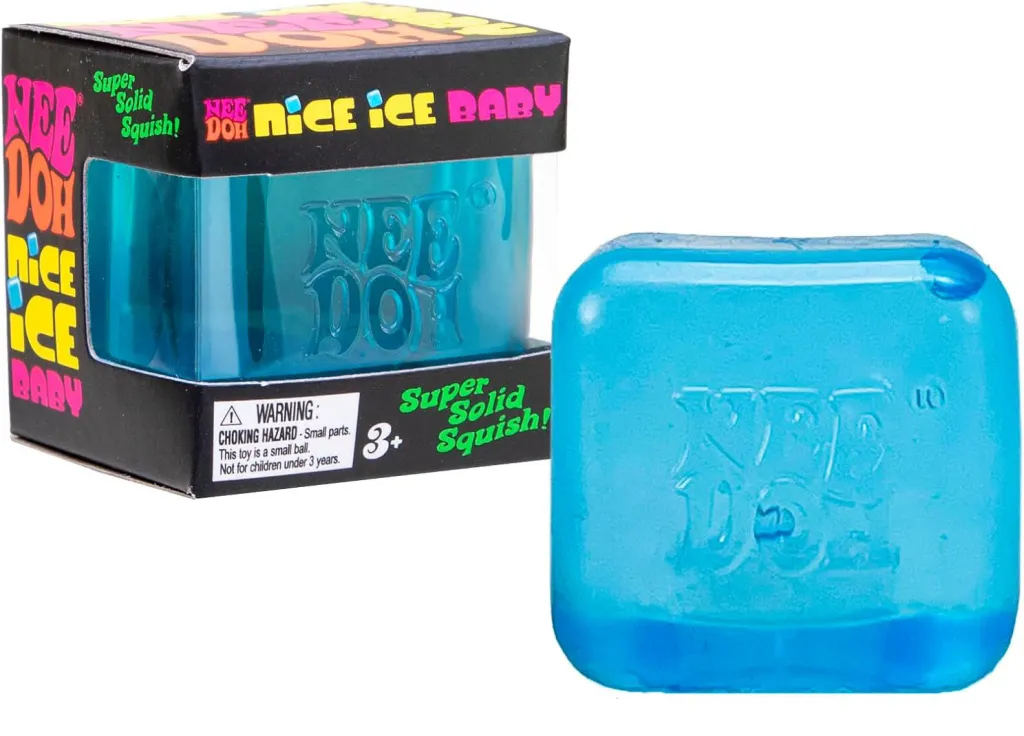 A NeeDoh Nice Ice Baby fidget toy, partially encased in its box, with a second NeeDoh toy out of its packaging to the right.