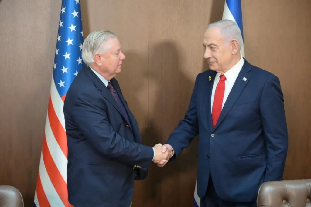 Israeli Prime Minister Benjamin Netanyahu shaking hands with U.S. Senator Lindsey Graham.