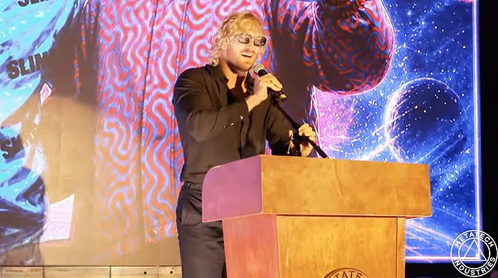 Oliver Tree performing live at a podium.