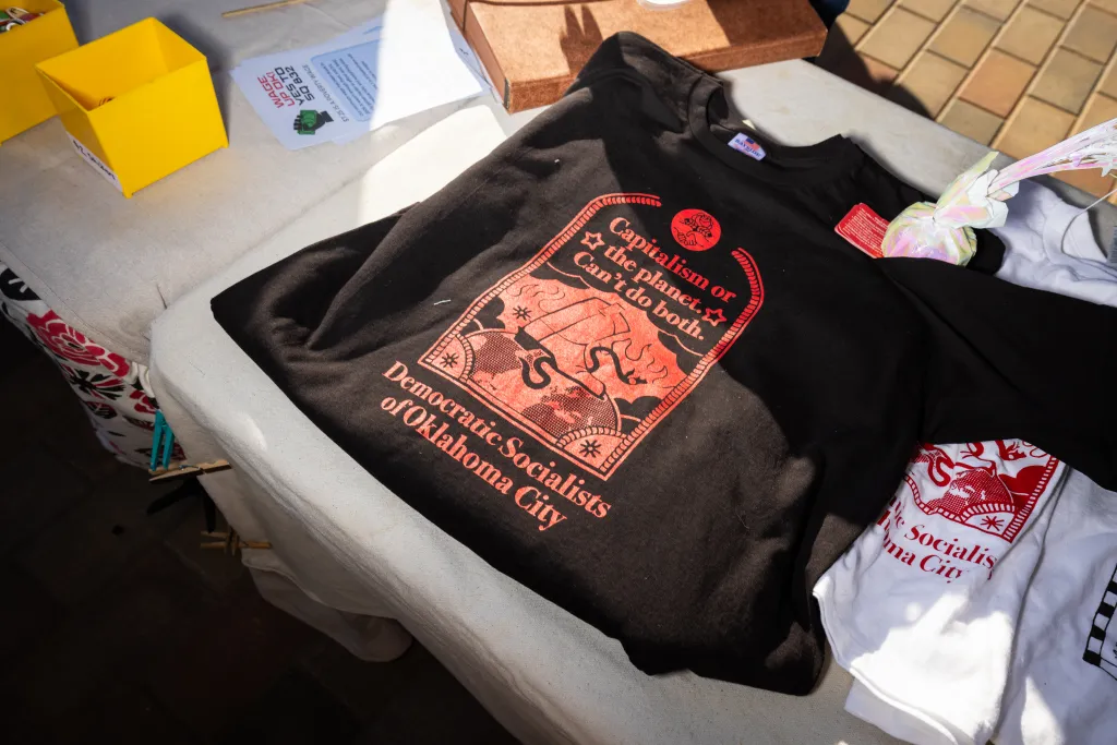 A black t-shirt with a red graphic that reads