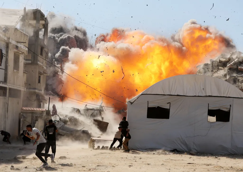 People fleeing during an Israeli airstrike in Gaza City.