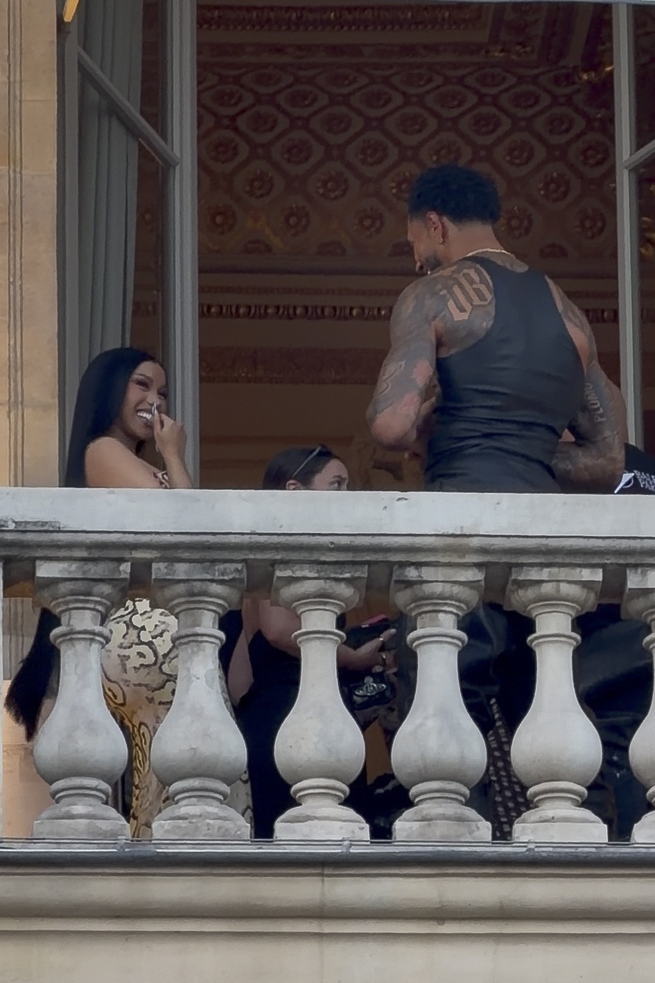 Cardi B and Maduka Okoye on a terrace in Paris.
