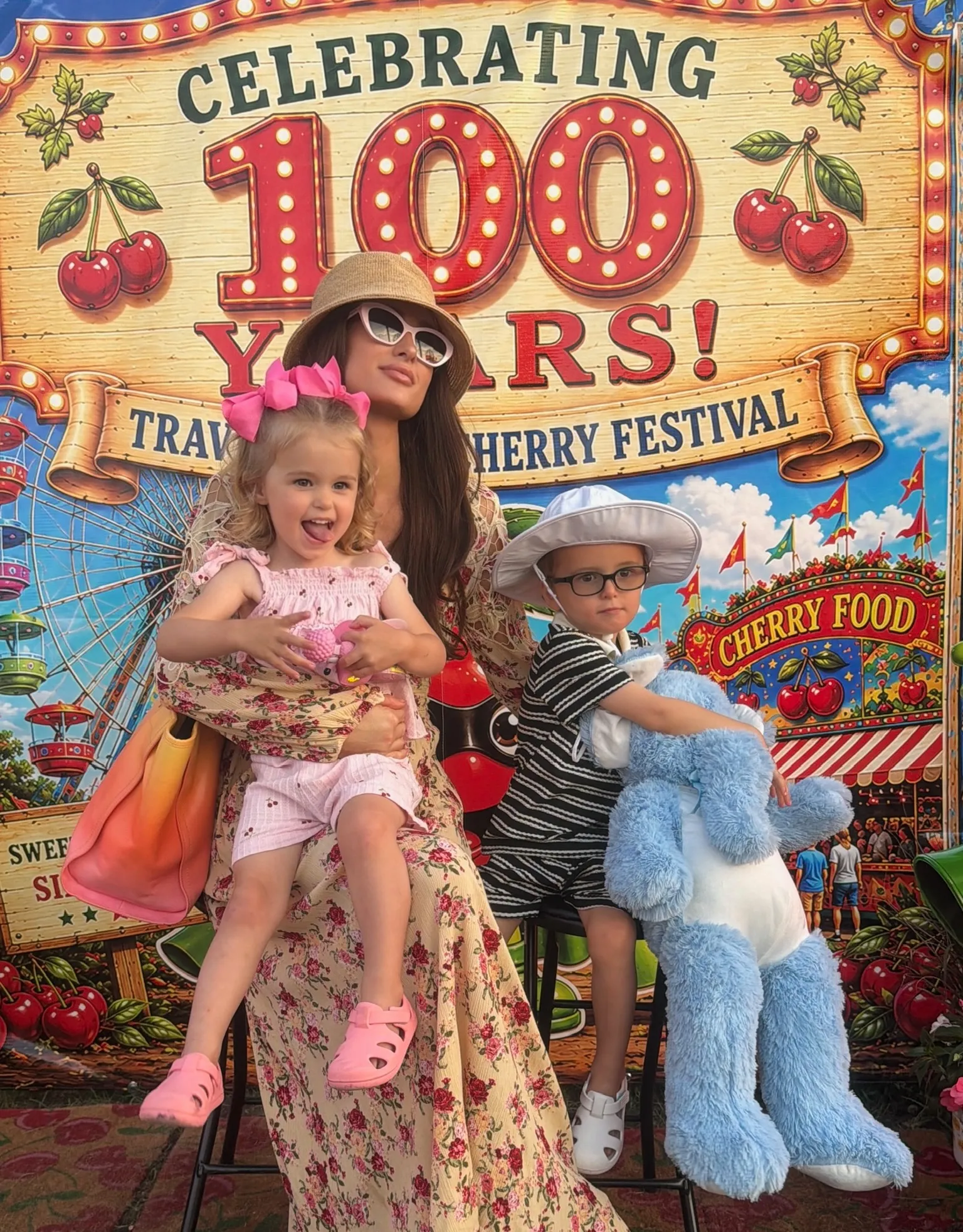Paris Hilton with her children at the Traverse City Cherry Festival.
