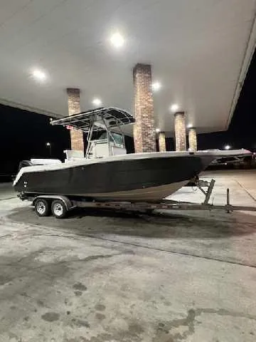 Paul's 24-foot center console Proline boat on a trailer under an awning.