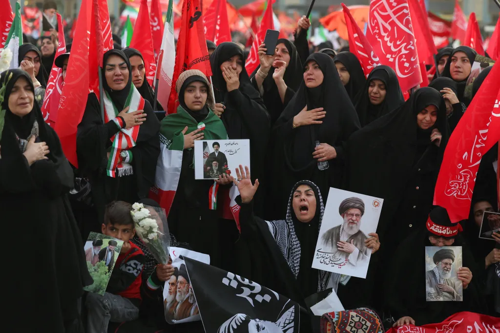 People hold up signs of Ali Khamenei during a public farewell ceremony at the Imam Khomeini Grand Mosalla, in Tehran, Iran, on July 4, 2026.
