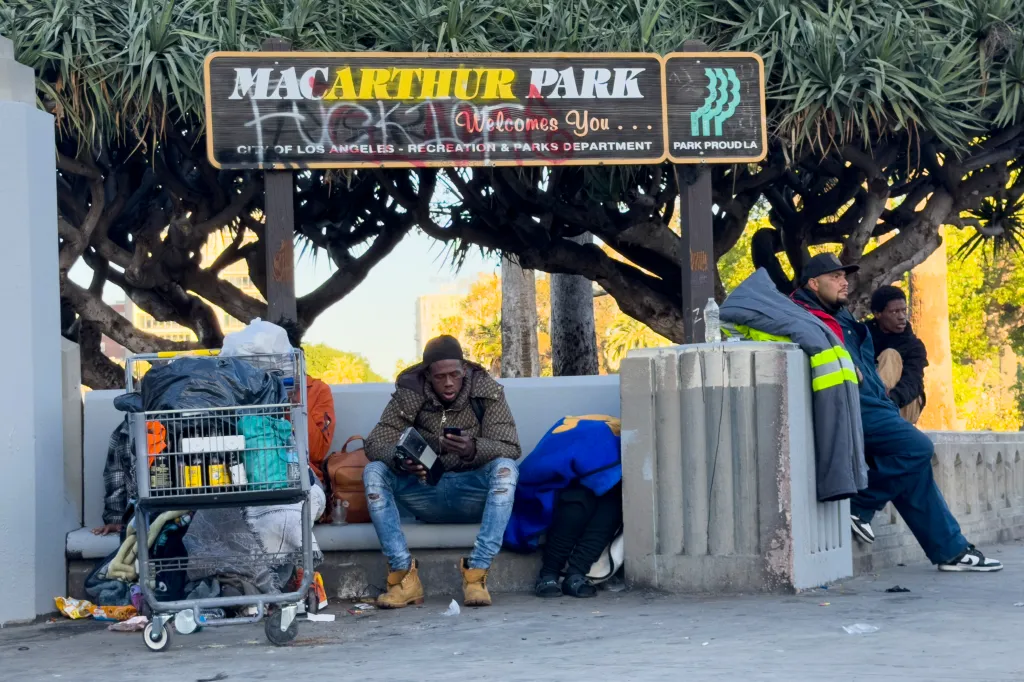 People are seen in MacArthur Park in Los Angeles.