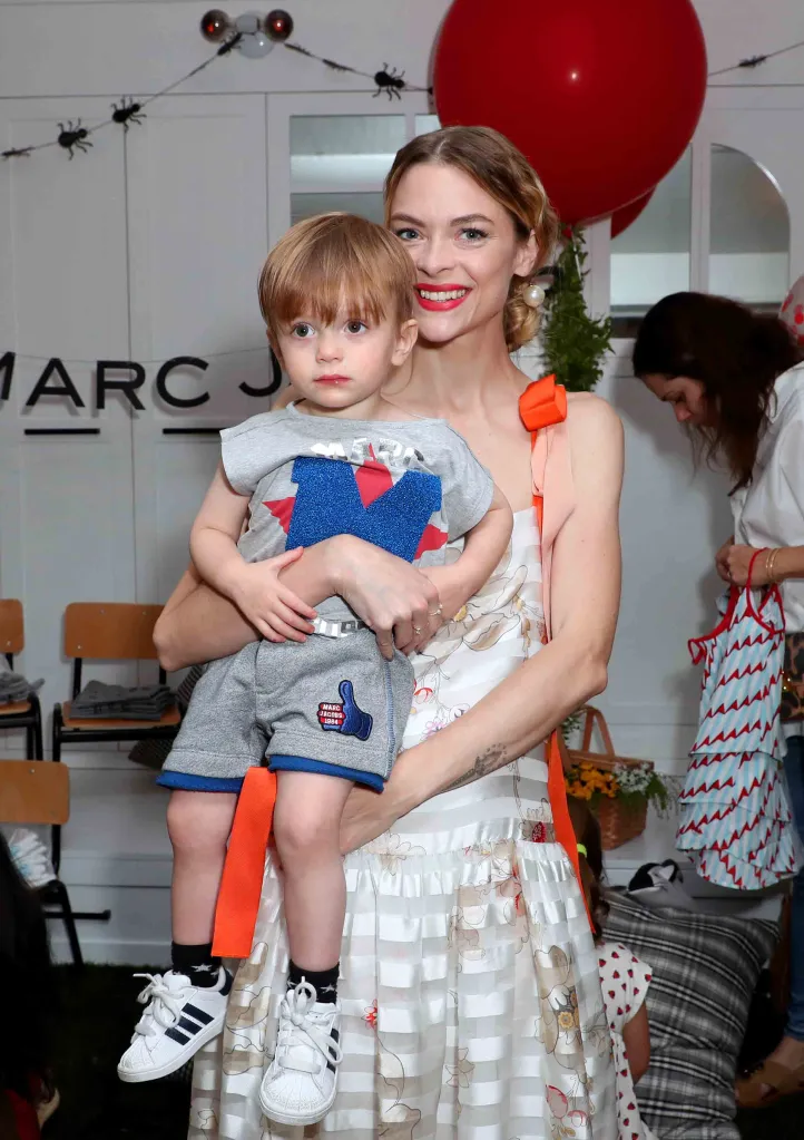 Jaime King holding Leo Newman at the Little Marc Jacobs celebration.