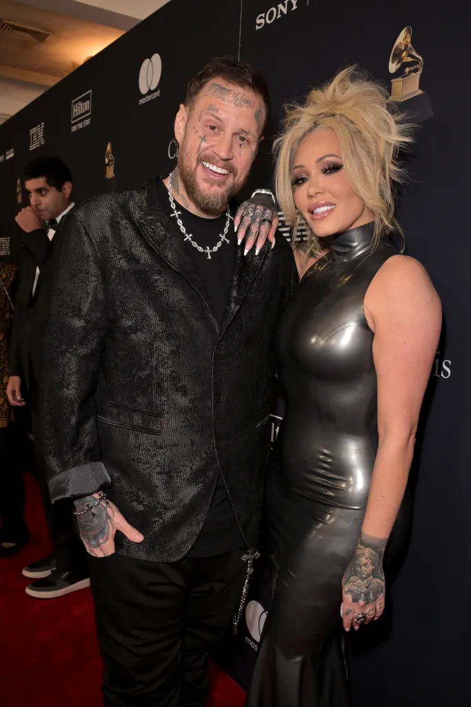 Jelly Roll and Bunnie Xo smiling while attending the 68th GRAMMY Awards Pre-GRAMMY Gala.