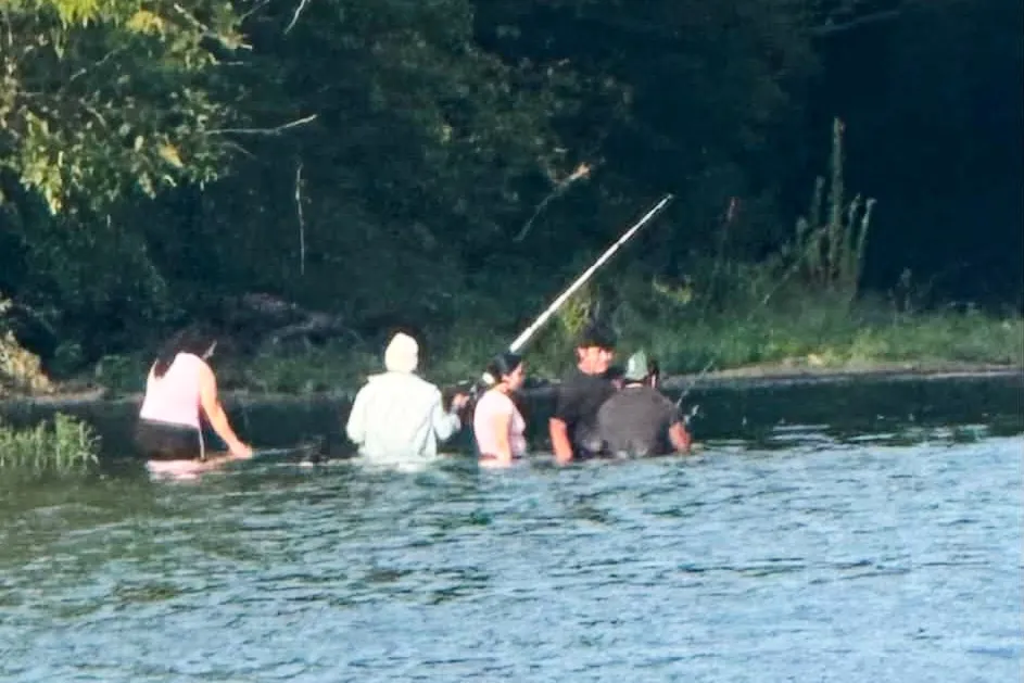 Possibly the last photo taken of the group, who had been fishing on the river when they drowned.