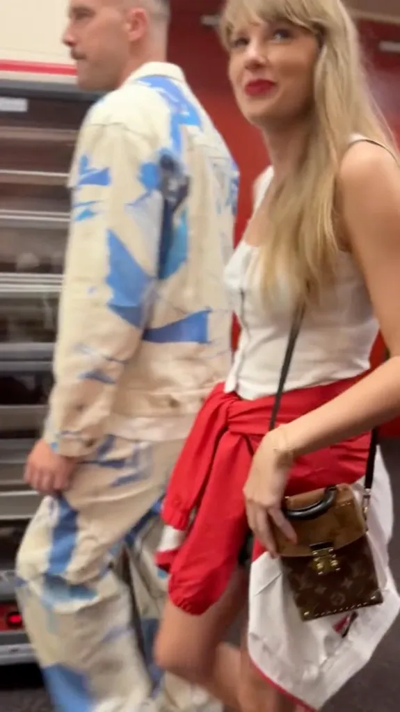 Taylor Swift and Travis Kelce leaving Arrowhead Stadium together.