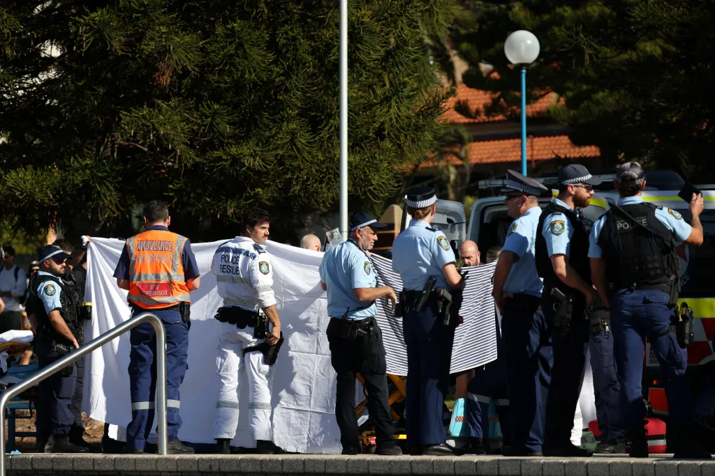Police and emergency personnel respond to the scene of a suspected shark attack in Sydney, Australia, on June 13, 2026.