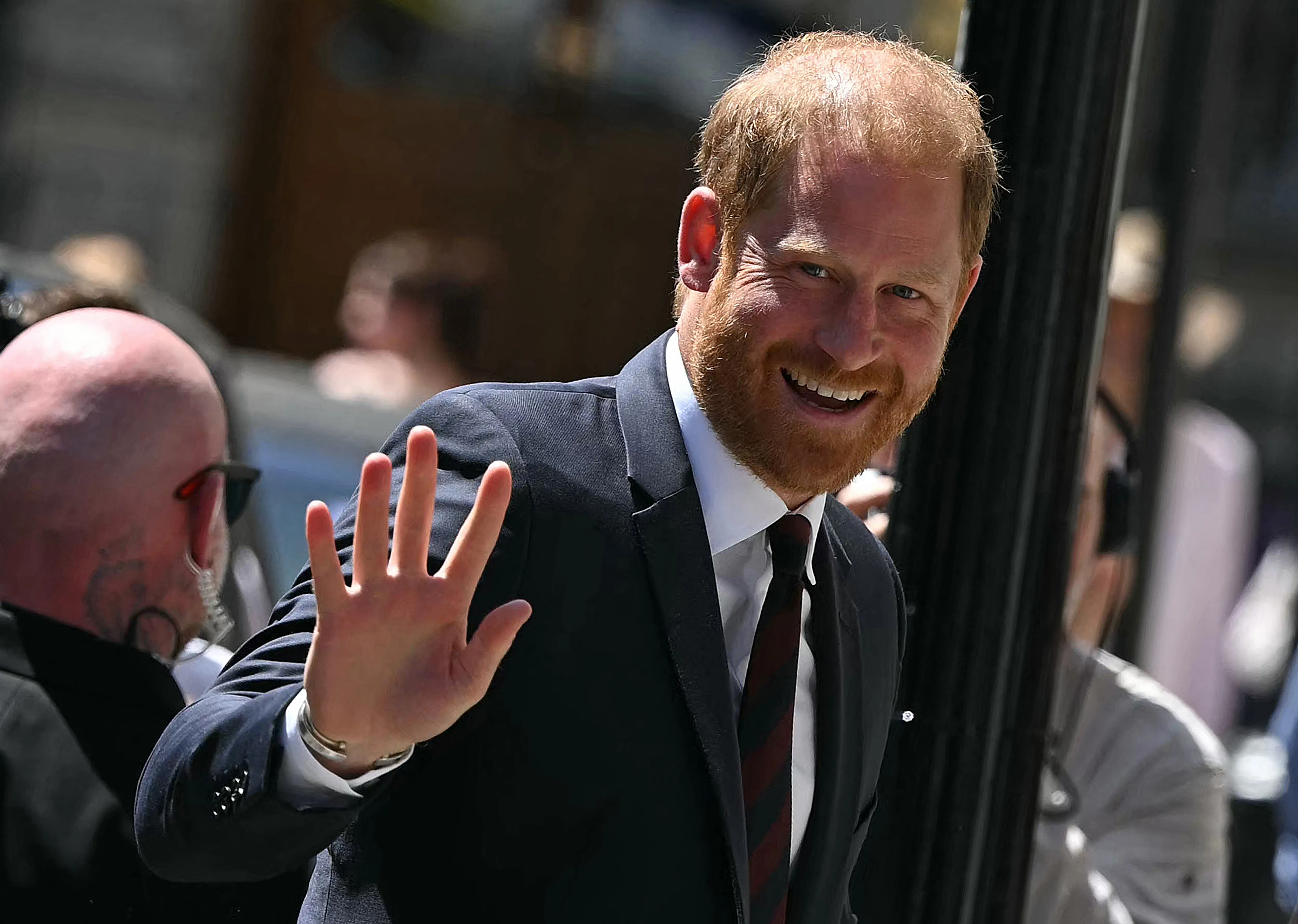 Prince Harry, Duke of Sussex, smiling and waving.
