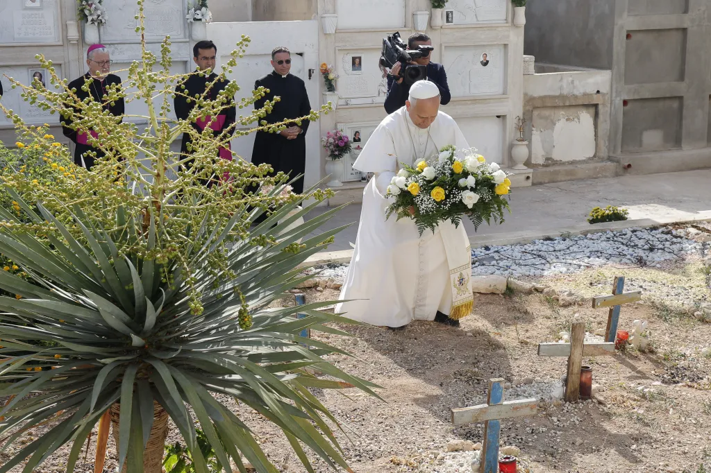 Pope Leo XIV visiting the cemetery of Lampedusa and laying flowers.