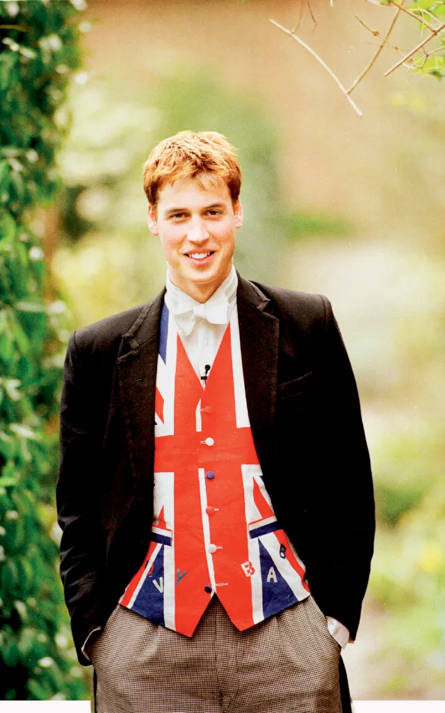 Prince William at Eton College wearing a jacket over a Union Jack vest with the words 'Groovy Baby'.