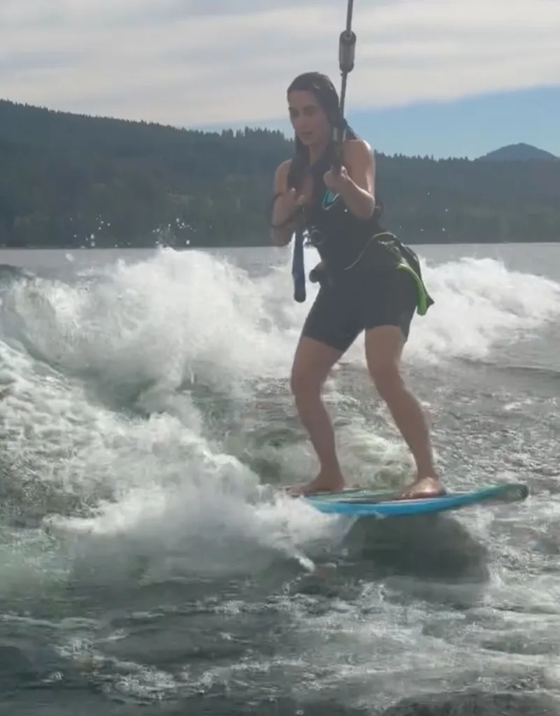 Kim Kardashian wakeboarding on a sunny day.