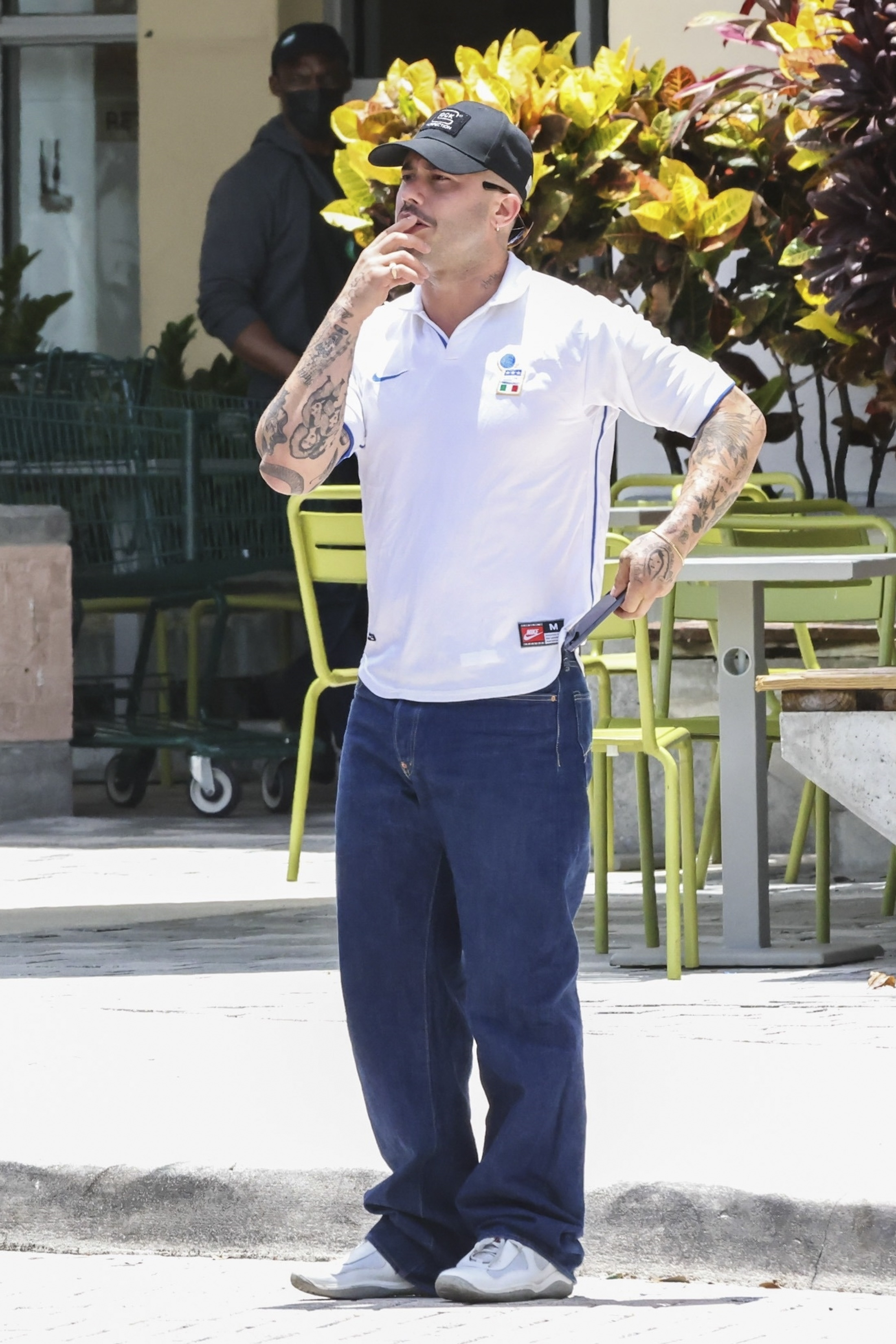 Ricky Alvarez in a white polo shirt, blue jeans, and a black baseball cap.